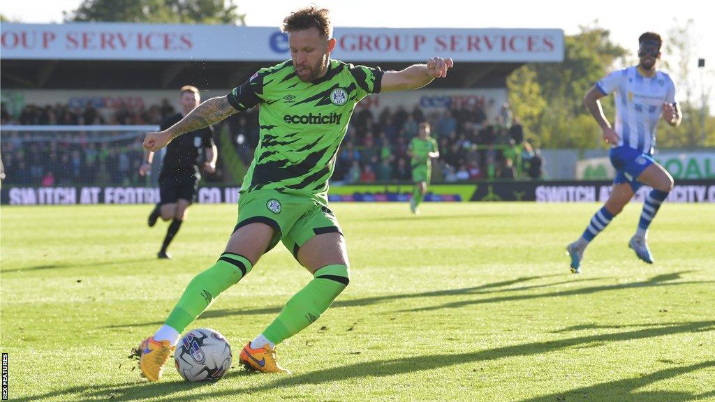 Matty Taylor prepares to strike to score his first league goal for Forest Green