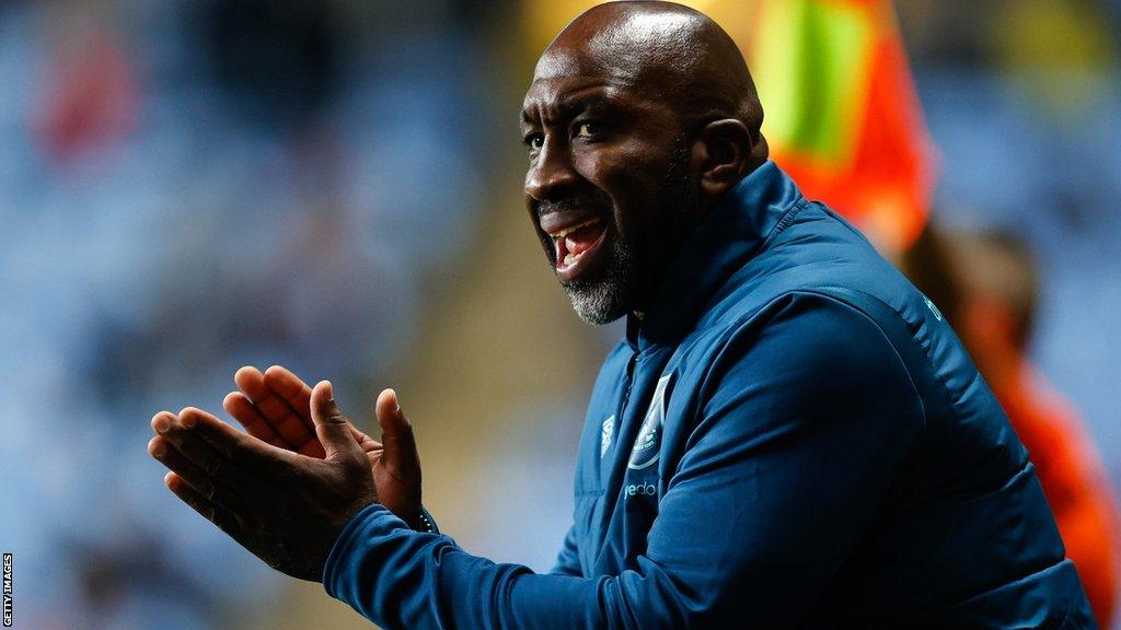 Darren Moore applauds and cajoles his players on the touchline