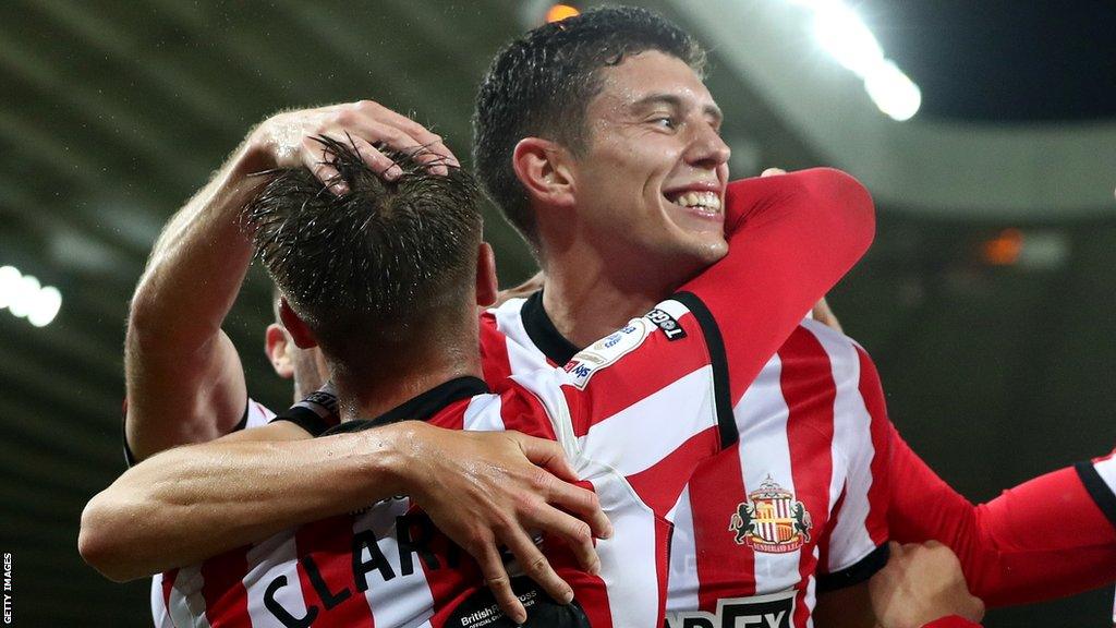 Ross Stewart is mobbed by his teammates after scoring against Rotherham