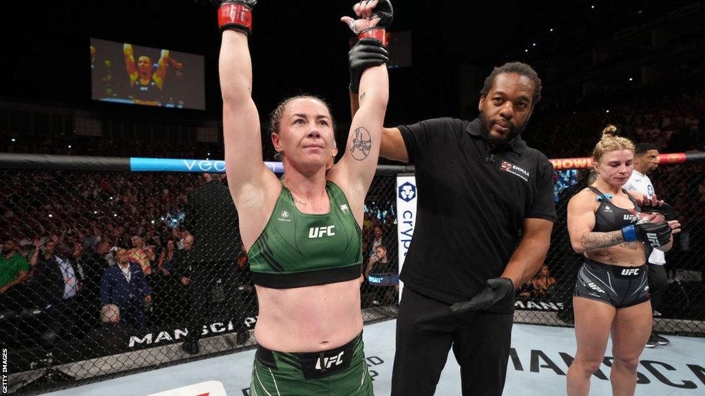 Molly McCann gets her arm raised after beating Hannah Goldy in July