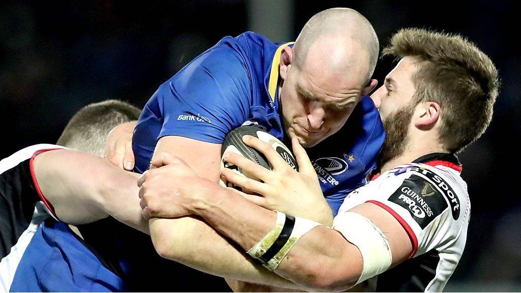 Leinster's Devin Toner is tackled by two Ulster players