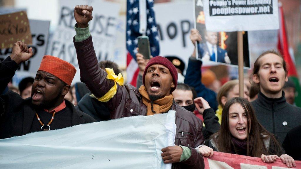 Protesters against Trump gather near the Pennsylvania Avenue parade route on inauguration day