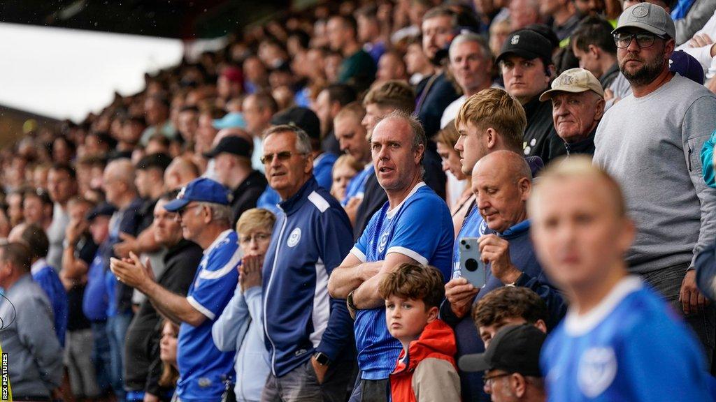 Portsmouth fans look concerned in the stands during a tight League One match at Fratton Park.