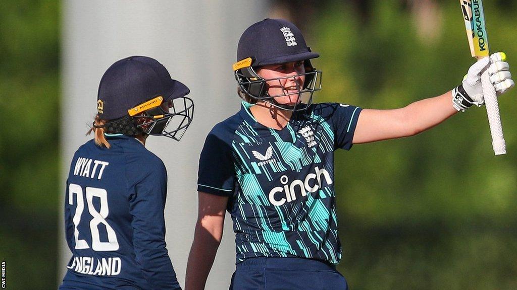 Nat Sciver raising her bat for a half-century v West Indies