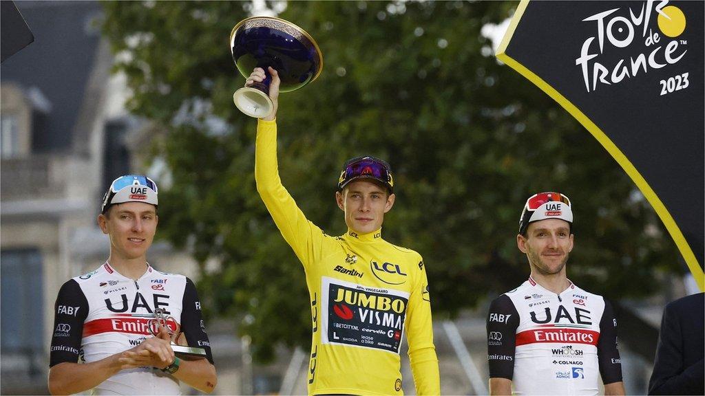 Jonas Vingegaard (middle) won the 2023 Tour de France from Tadej Pogacar (left) and Adam Yates (right)