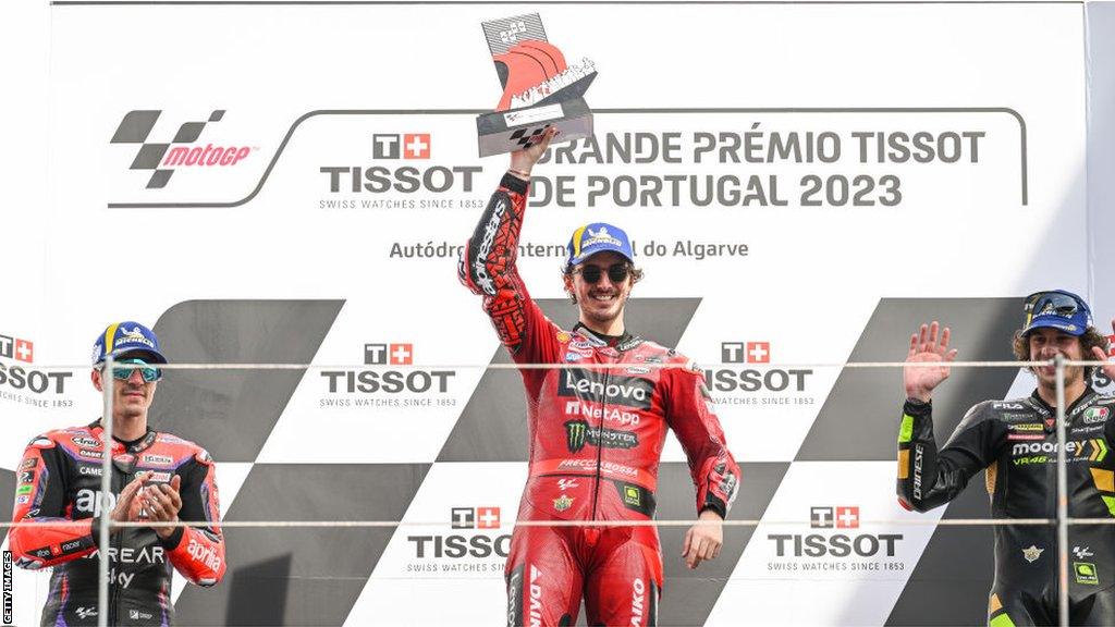 Francesco Bagnaia celebrates on podium