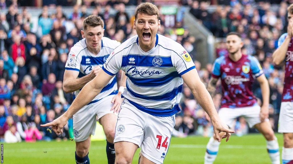 Chris Martin runs in celebration of a goal he scored for QPR last season