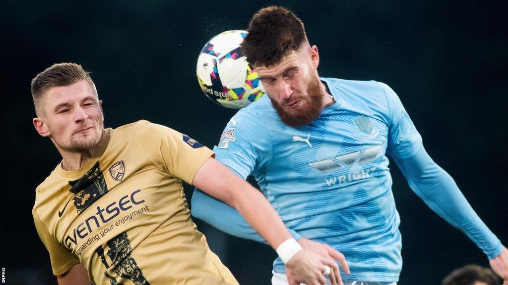Andy Mitchell and Kym Nelson in aerial action during Tuesday's derby encounter at Ballymena