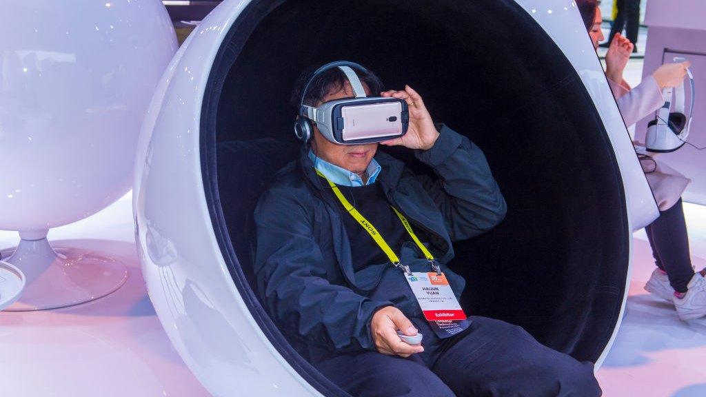 Man wearing VR headset at a trade show