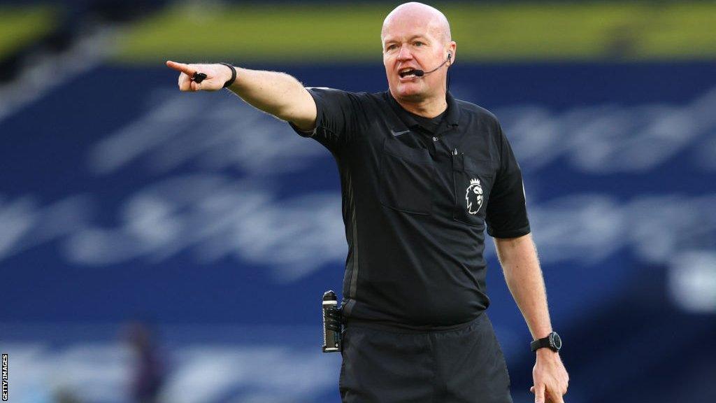 Lee Mason refereeing a match