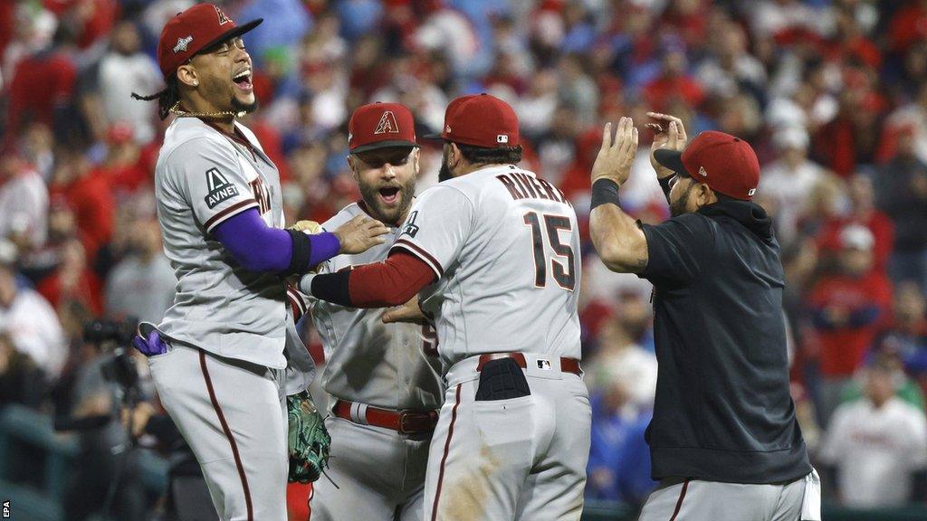 Arizona Diamondbacks players Ketel Marte, Christian Walker and Emmanuel Rivera celebrate