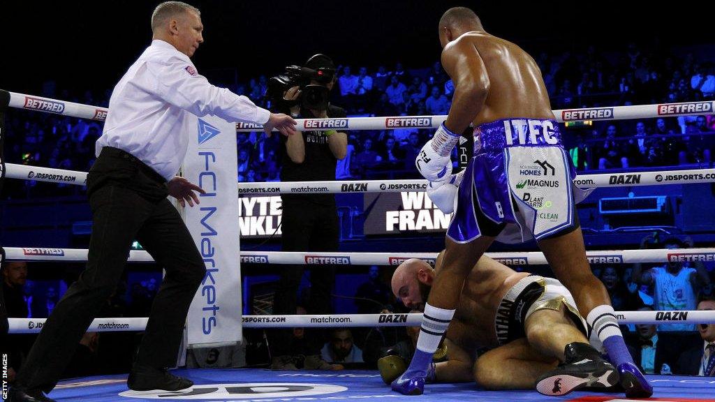 Fabio Wardley stands over a downed Nathan Gorman