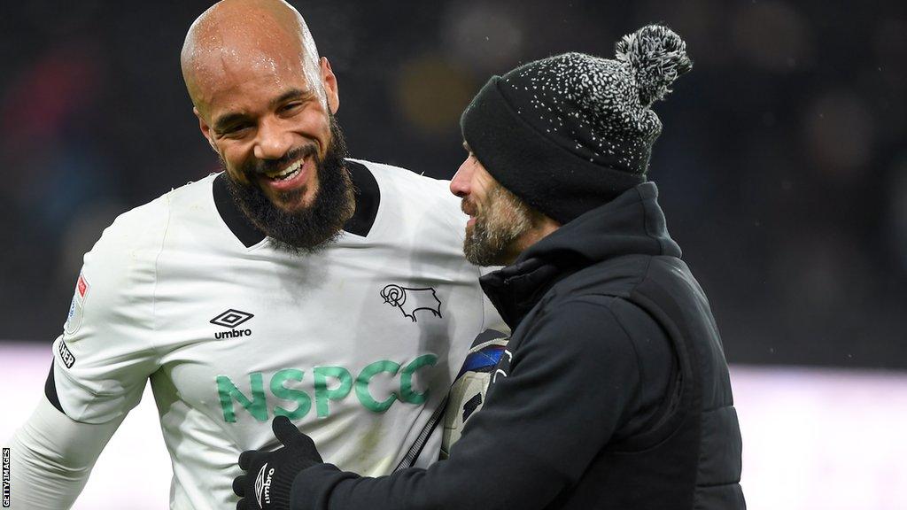 Derby striker David McGoldrick gets a hug from boss Paul Warne