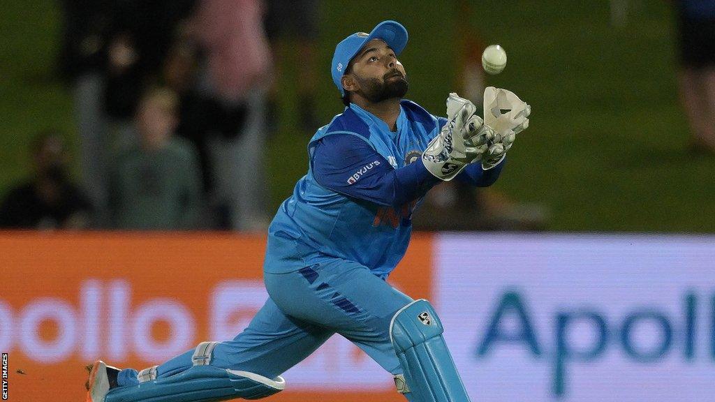 Rishabh Pant watches the ball as he looks to take a catch