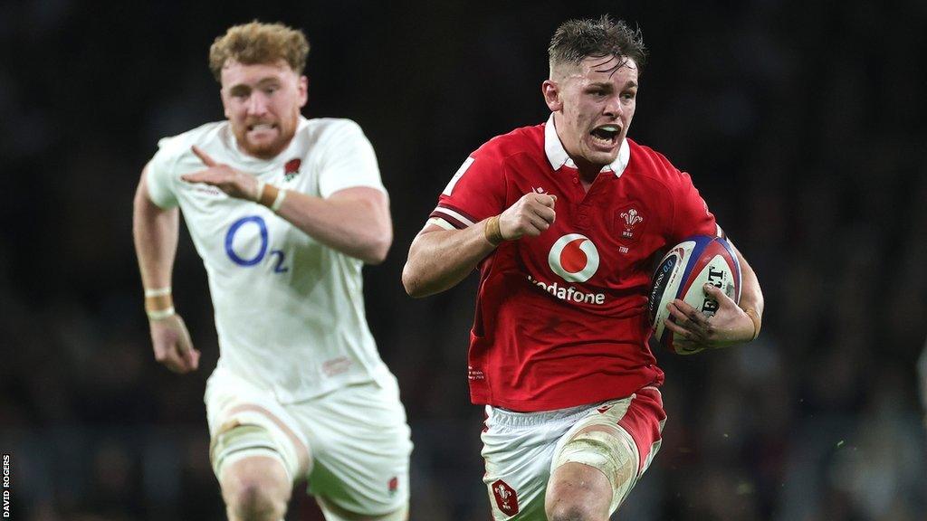 Alex Mann of Wales breaks clear of Ollie Chessum to score a try against England