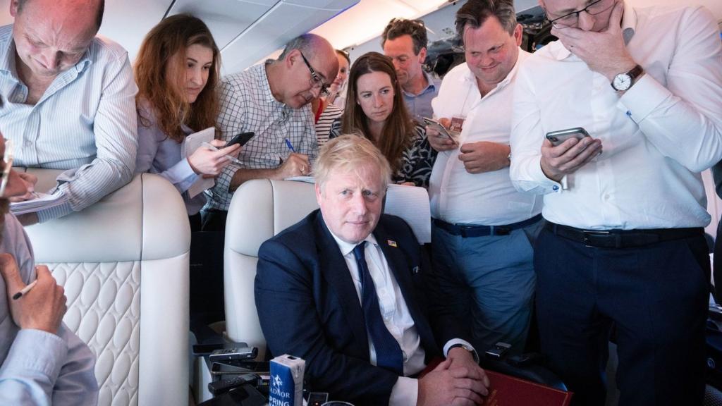 Boris Johnson on the plane to India