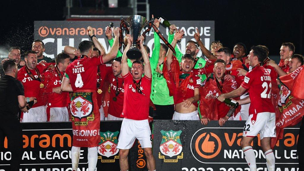 Wrexham players celebrate with the National League Trophy