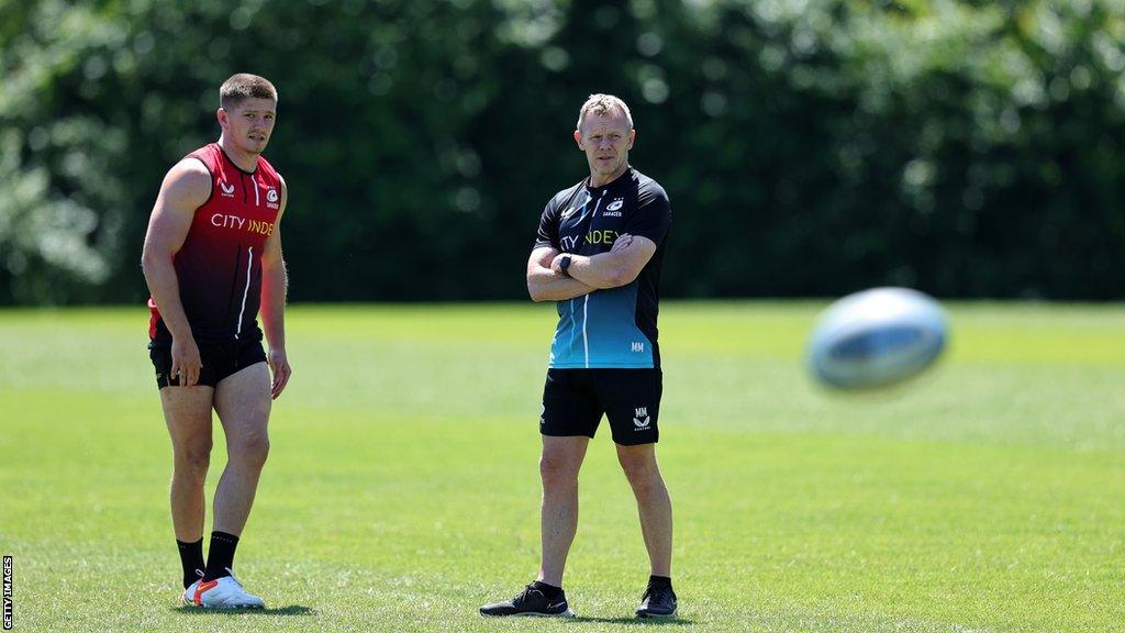 Owen Farrell (left) and Mark McCall at a Saracens training session