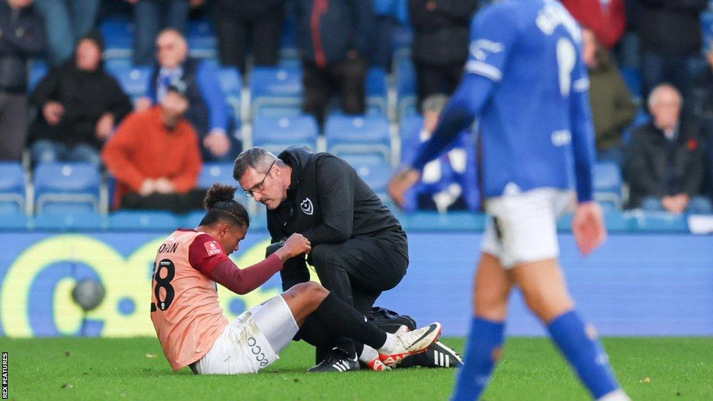 Portsmouth midfielder Tino Anjorin gets injured and is substituted during the FA Cup match between Chesterfield and Portsmouth.