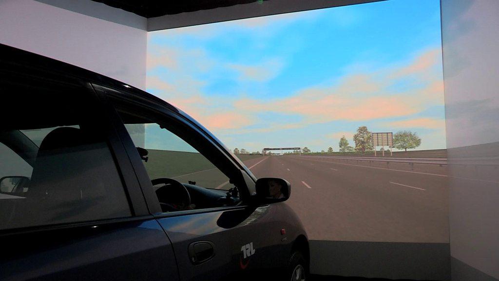 Angela Rippon in car simulator