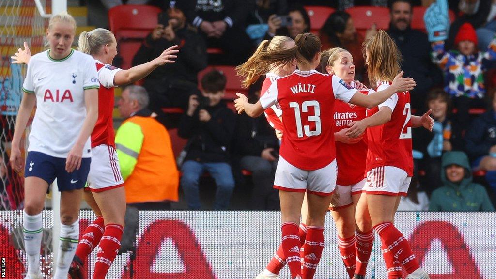 Arsenal celebrate scoring against Tottenham