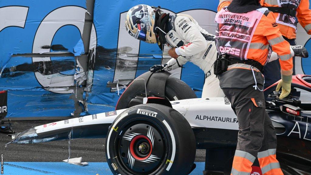 Daniel Ricciardo gets out of his Alpha Tauri after crashing at Zandvoort