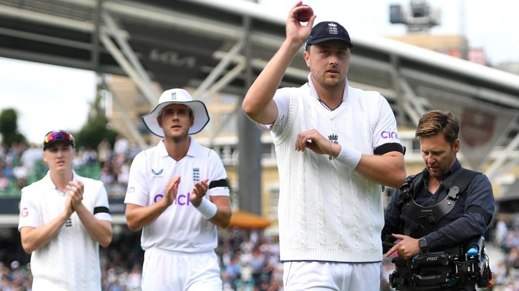 England bowler Ollie Robinson raises the ball to the crowd after taking a five-wicket haul