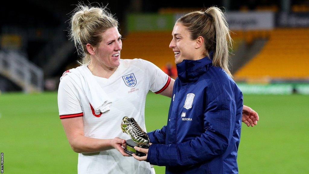 Millie Bright of England embraces Alexia Putellas of Spain with the Golden Boot Award