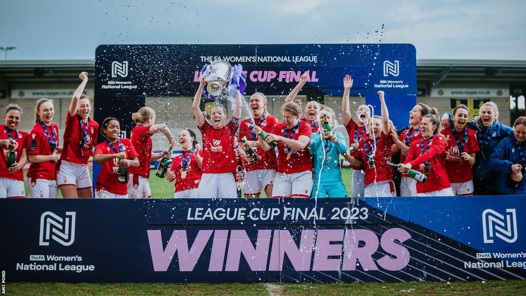 Nottingham Forest players celebrate and lift their League Cup trophy