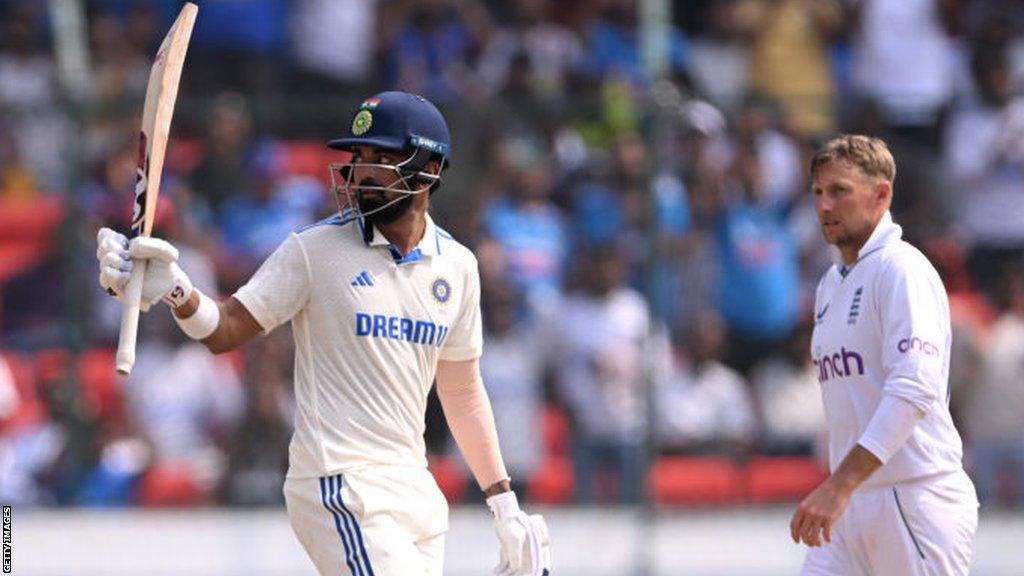 KL Rahul raises his bat after reaching half century