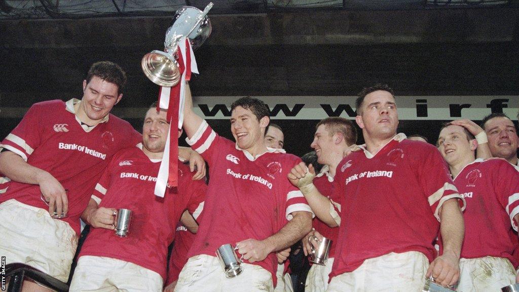 Tony McWhirter (left) celebrates Ulster's 1999 triumph at Lansdowne Road as full-back Simon Mason holds the trophy aloft