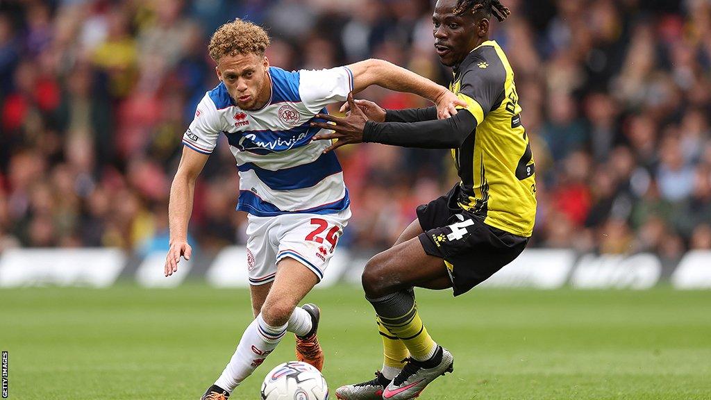 Tom Dele-Bashiru of Watford battles with Stephen Duke-McKenna of QPR