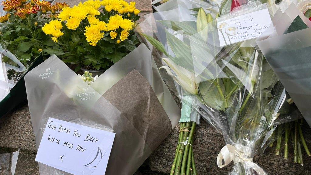 Floral tributes after the explosion in a block of flats in Jersey