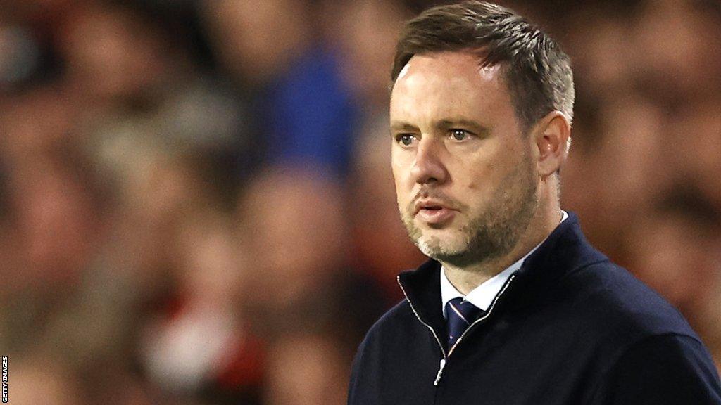 Michael Beale stands at pitchside while Rangers boss