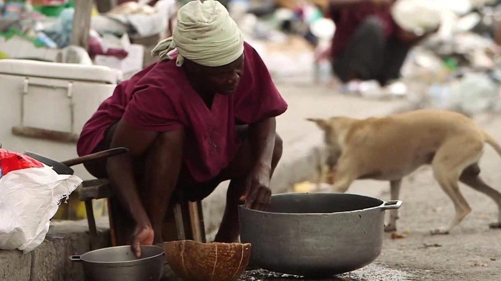 Woman and dog in Haiti