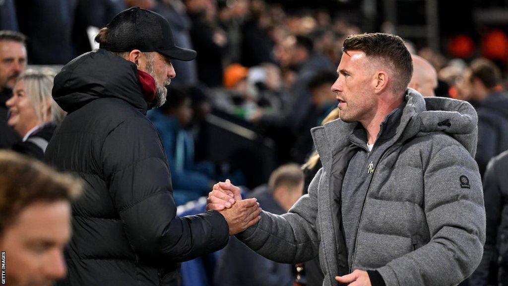 Luton boss Rob Edwards shakes hands with Liverpool manager Jurgen Klopp