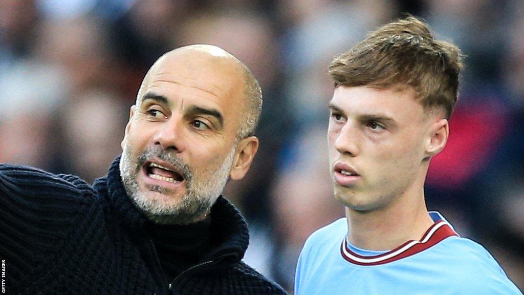 Manchester City manager Pep Guardiola and Chelsea forward Cole Palmer