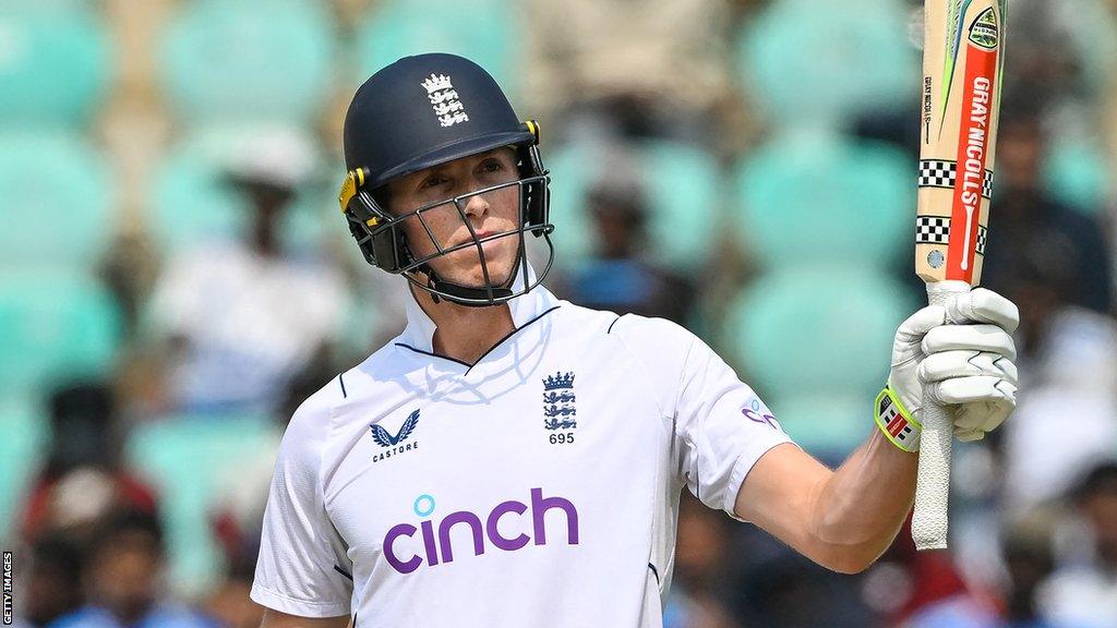 England opener Zak Crawley raises his bat after hitting a fifty