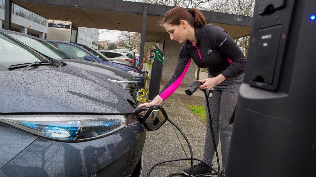 Electric car being charged