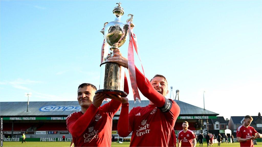 Connah's Quay Nomads' Jordan Davies and John Disney show off the Welsh Cup