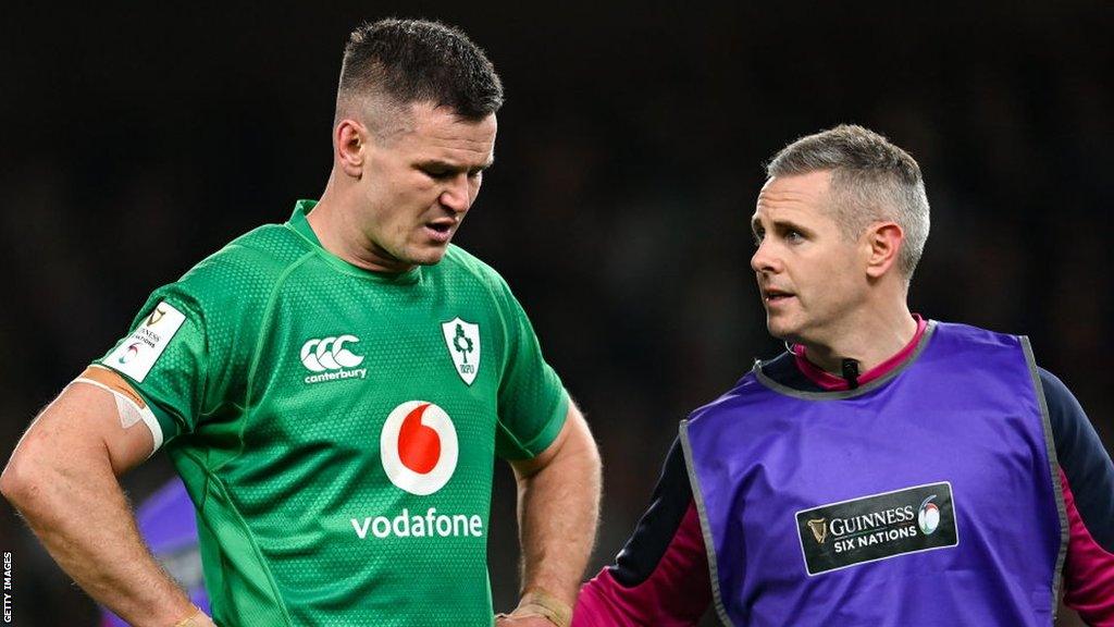 Johnny Sexton retired hurt with a knee injury during Ireland's Six Nations-clinching win over England on 18 March