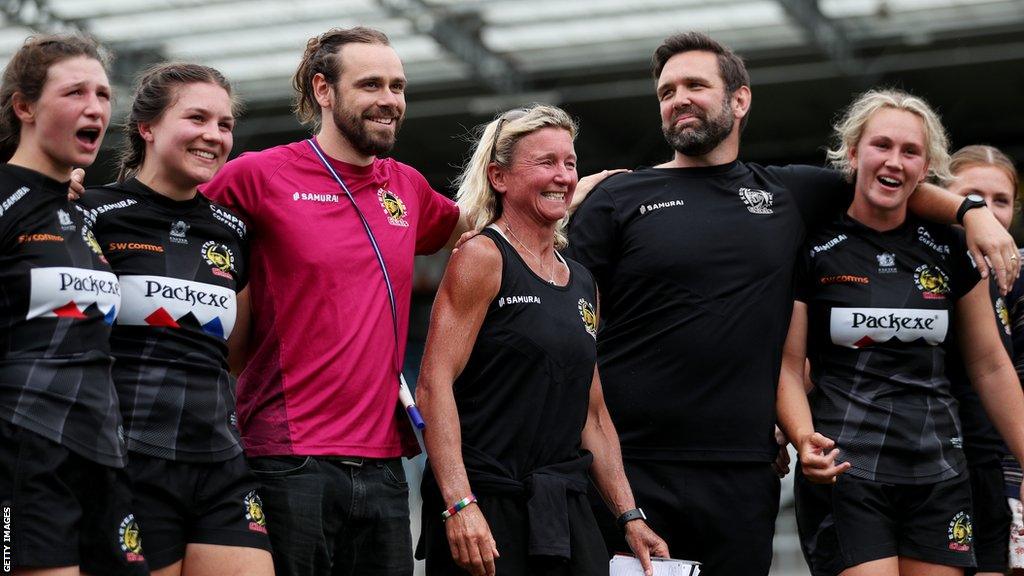 Susie Appleby celebrates with Exeter players and coaches