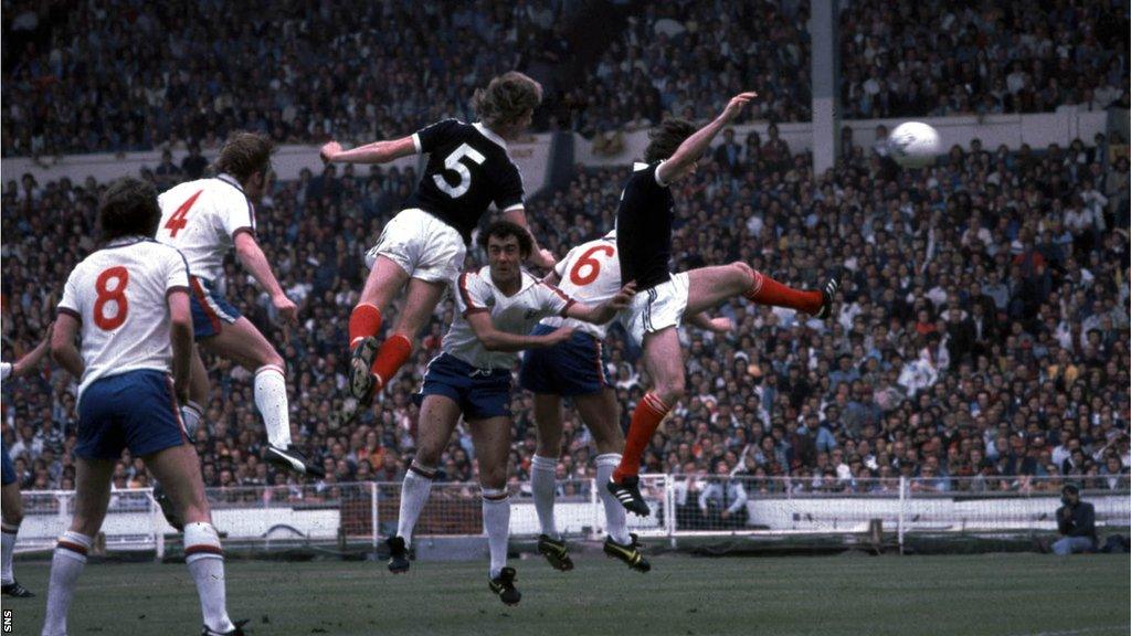 Gordon McQueen's header flies towards the England net