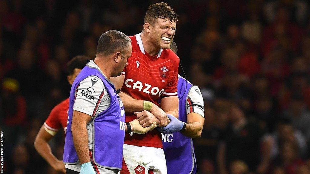 Will Rowlands winces in pain as he is helped from the field during Wales' autumn Test against Argentina