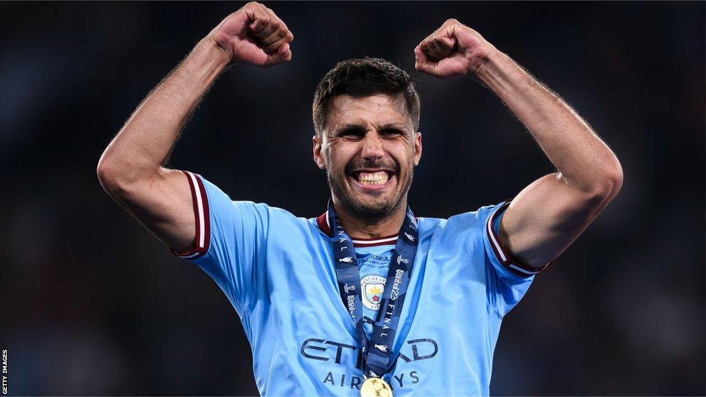 Rodri celebrates with 2023 Champions League winner's medal.