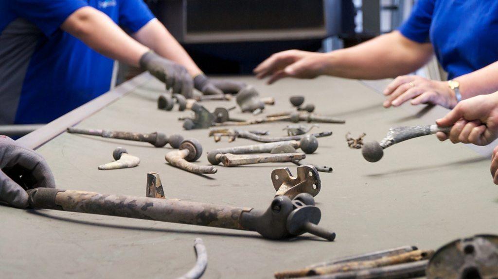 Hands reaching for metal objects