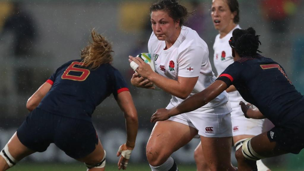 Amy Cokayne of England is tackled