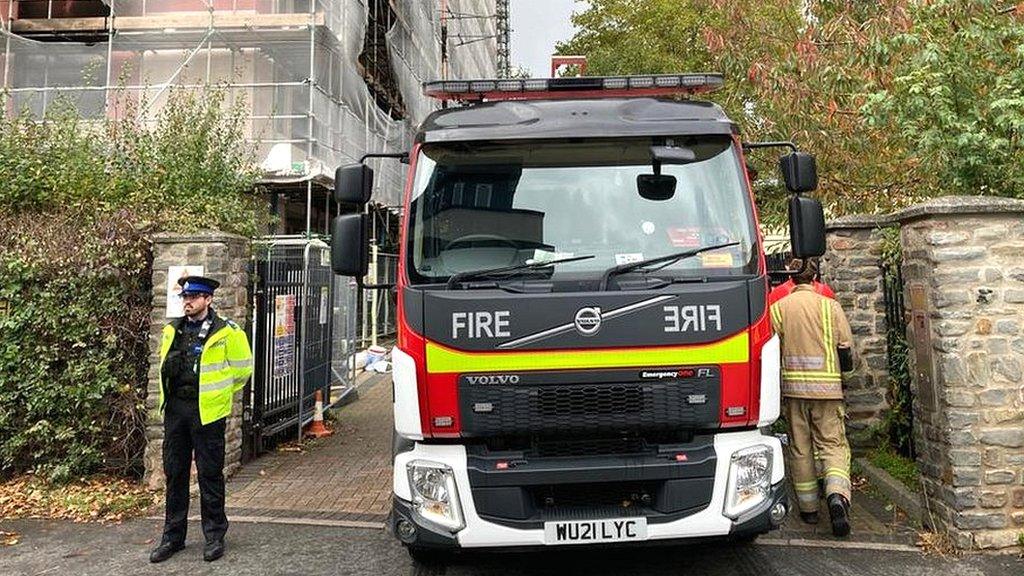 A fire engine and police on Aiken Street