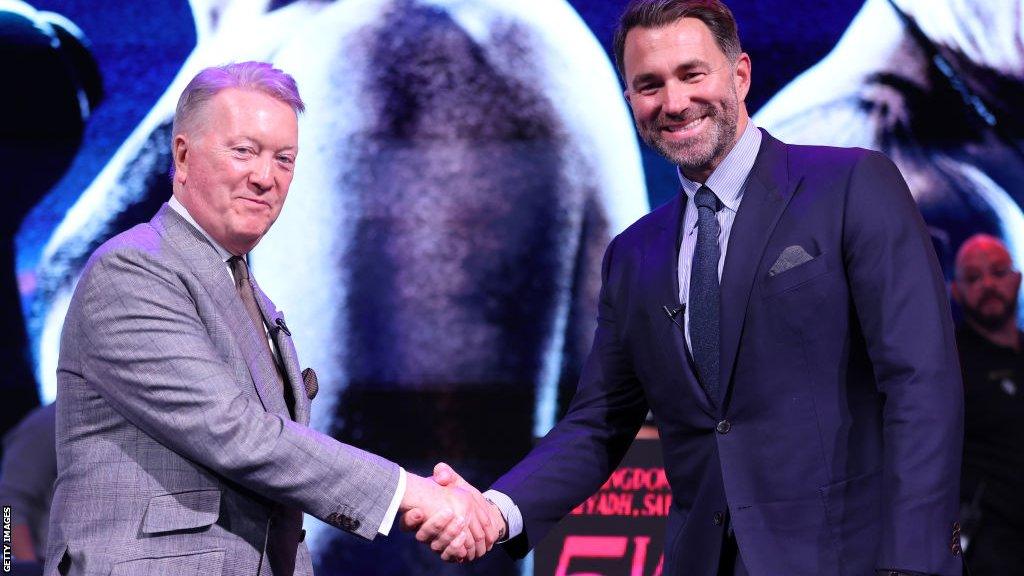 Frank Warren shakes the hand of Eddie Hearn