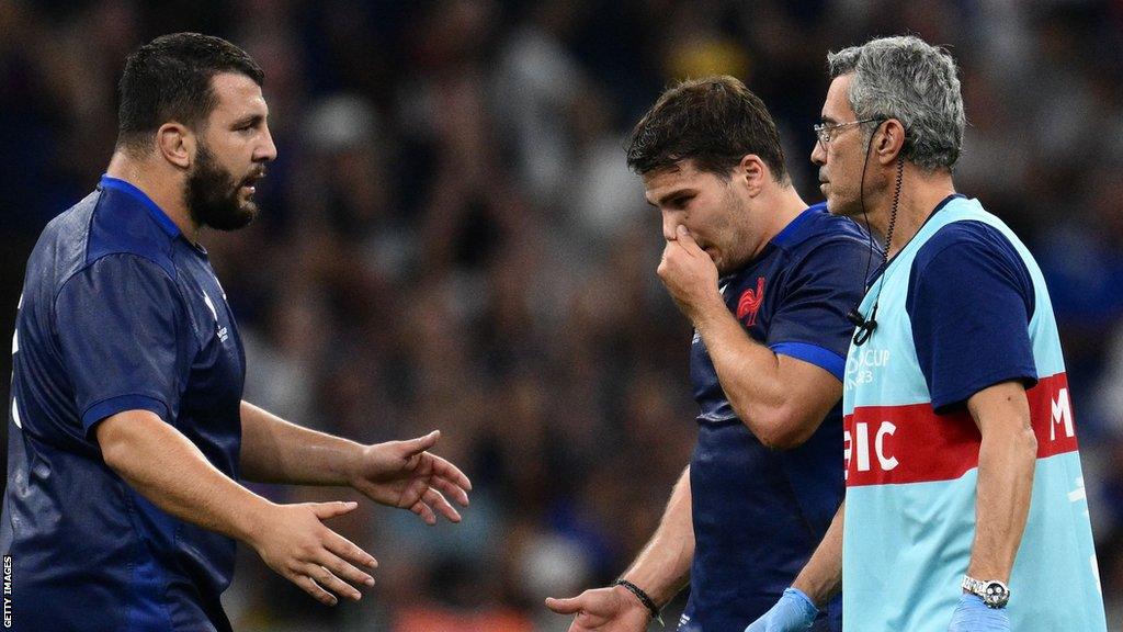 France prop Dorian Aldegheri consoles captain Antoine Dupont as he leaves the field